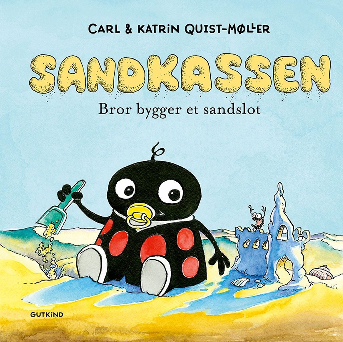 Sandkassen. Bror bygger et sandslot