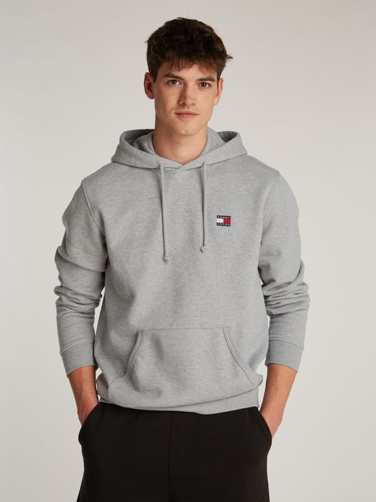 TJM REG BADGE HOODIE EXT